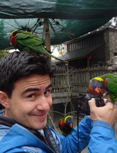 Alejandro Rico-Guevara with lorikeets