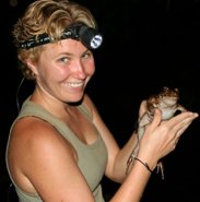Kristiina Hurme holding a frog during night fieldwork in Panama